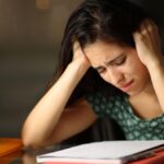 Student studying alone for JEE and NEET preparation at home highlighting the mental health impact of dummy school admissions.